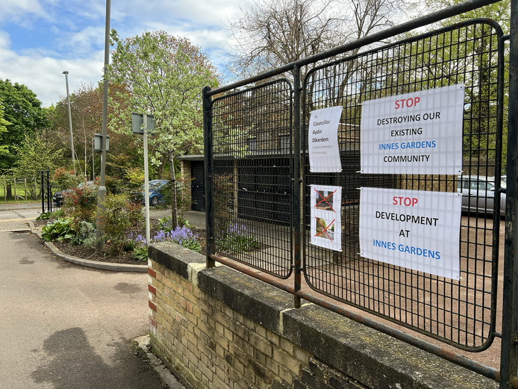 Protest signs at Innes Gardens