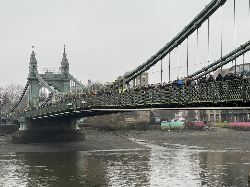 Pedestrians queue up to cross Hammersmith Bridge