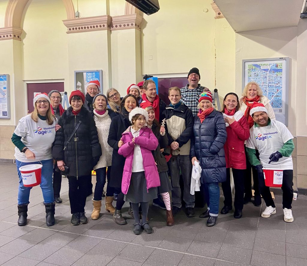 Dover House Singers Carolling at Putney Station 2024 - Putney.news