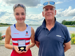 Gold medal winner Ella McDougall with coach Tim Park
