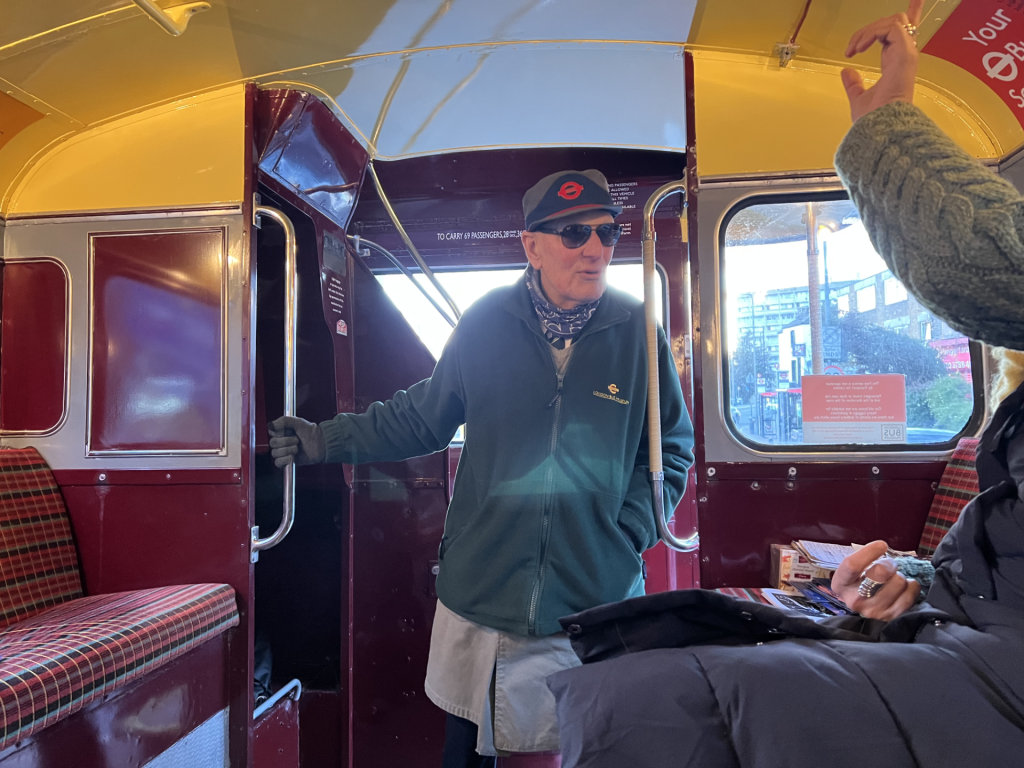 Volunteer conductor Pete, who spent decades on London's buses, aboard the Routemaster