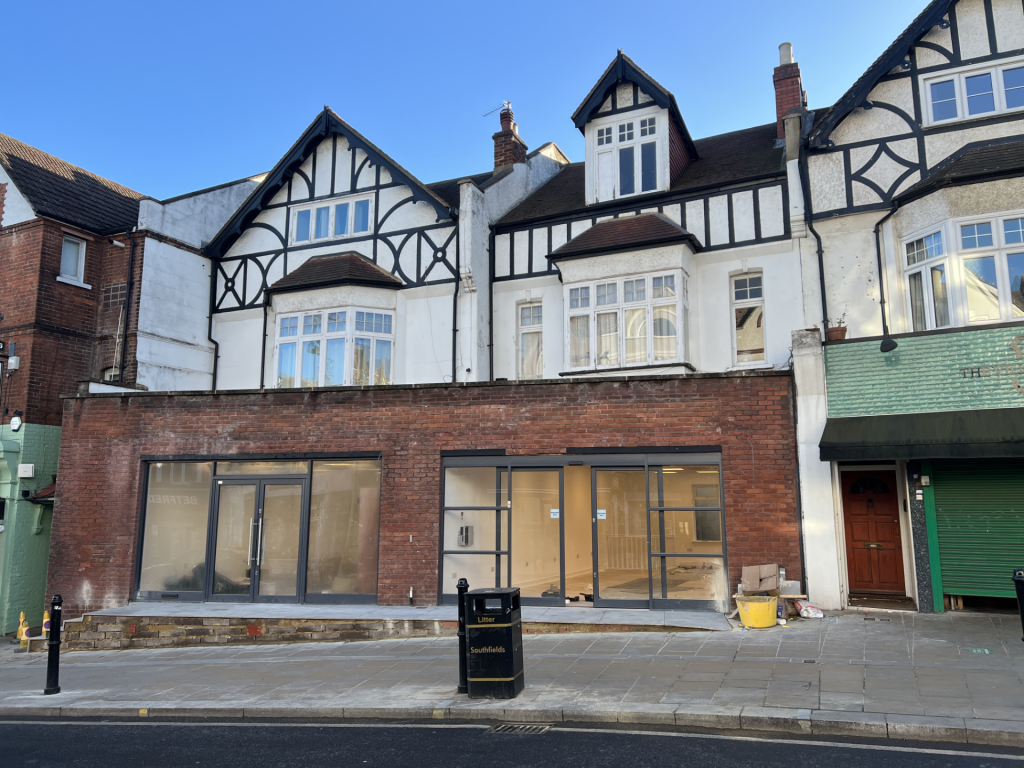 The building in question on Replingham Road. Flat 16A is above the shop on the right.
