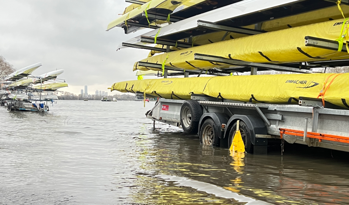 Rowing boats in flood water at Putney Embankment