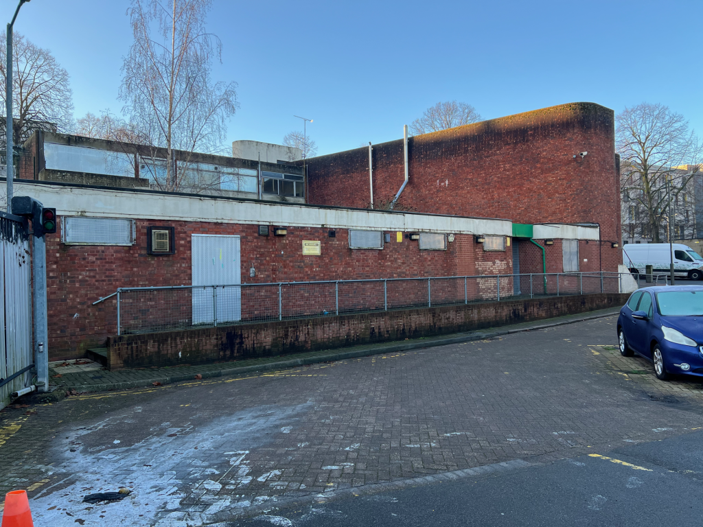 The current building that will be replaced by a nine-story residential building.