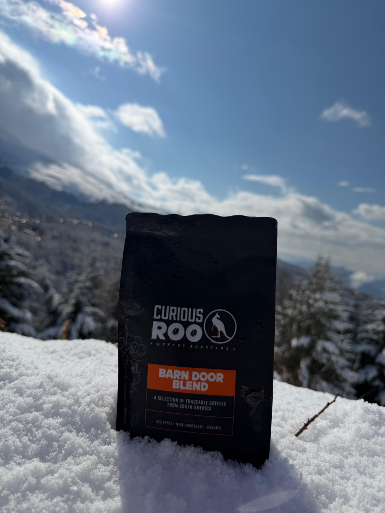 Curious Roo coffee bag in the Alps