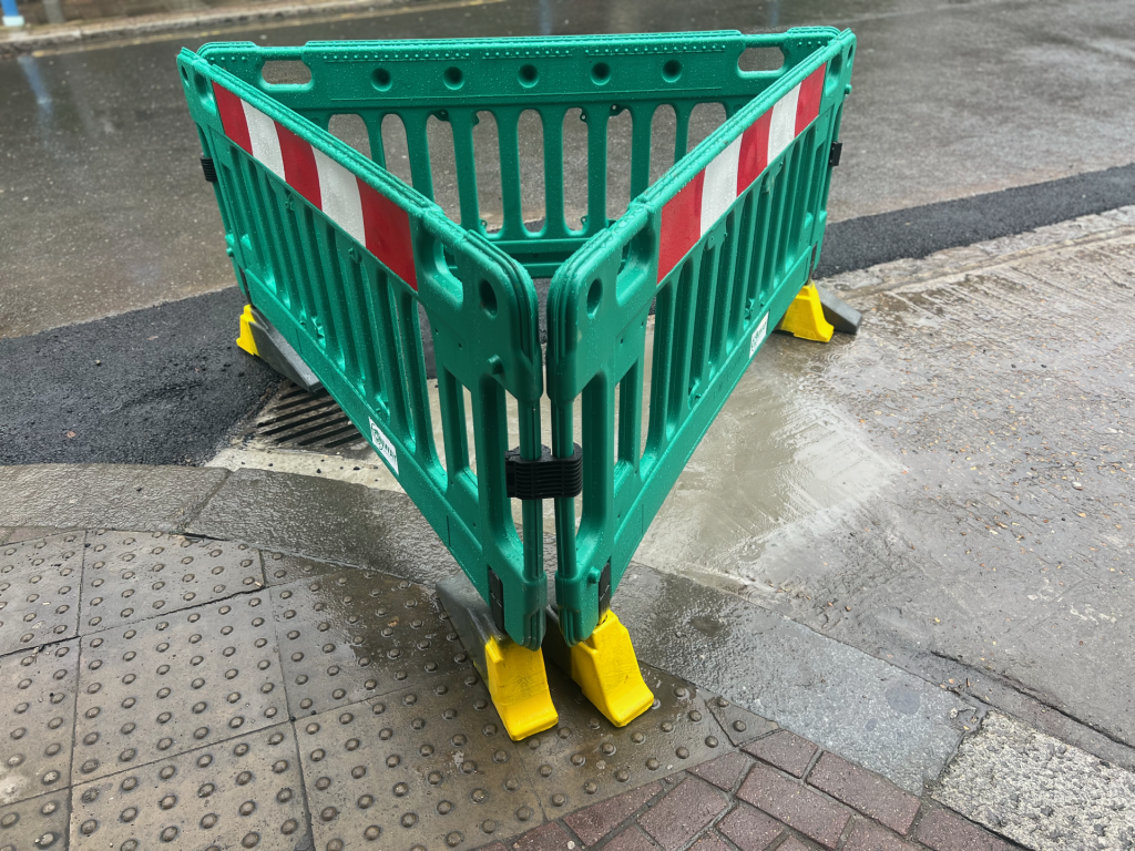 The new drain installed at the Putney Puddle junction. Works this week repositioned the original drain and added a second — confirmed effective when rain fell and the puddle did not.