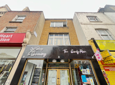 Squatters on Putney High Street with 1312 sign