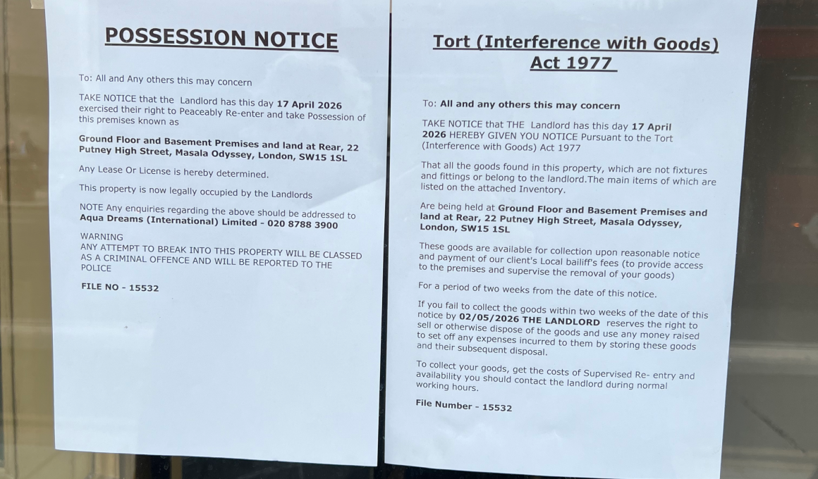 Two posted legal notices taped to a window: a 'Possession Notice' and a 'Tort (Interference with Goods) Act 1977' notice.