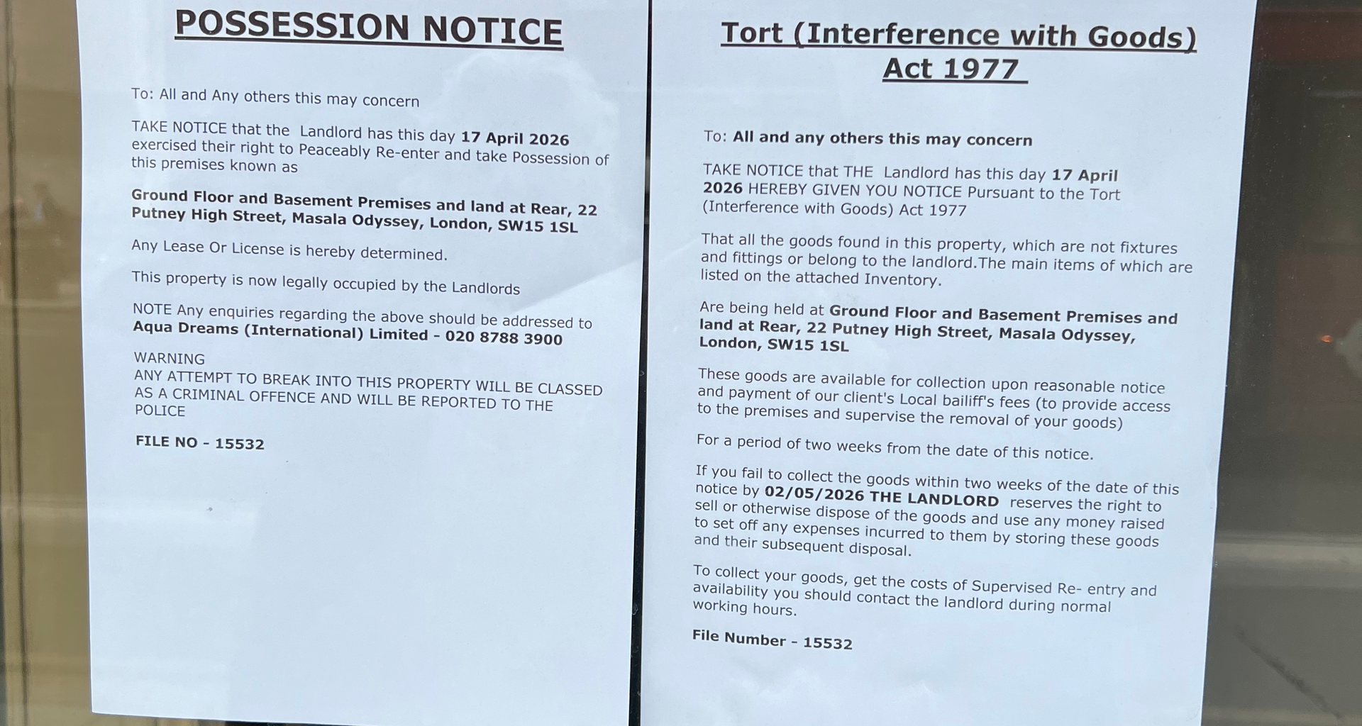 Two posted legal notices taped to a window: a 'Possession Notice' and a 'Tort (Interference with Goods) Act 1977' notice.