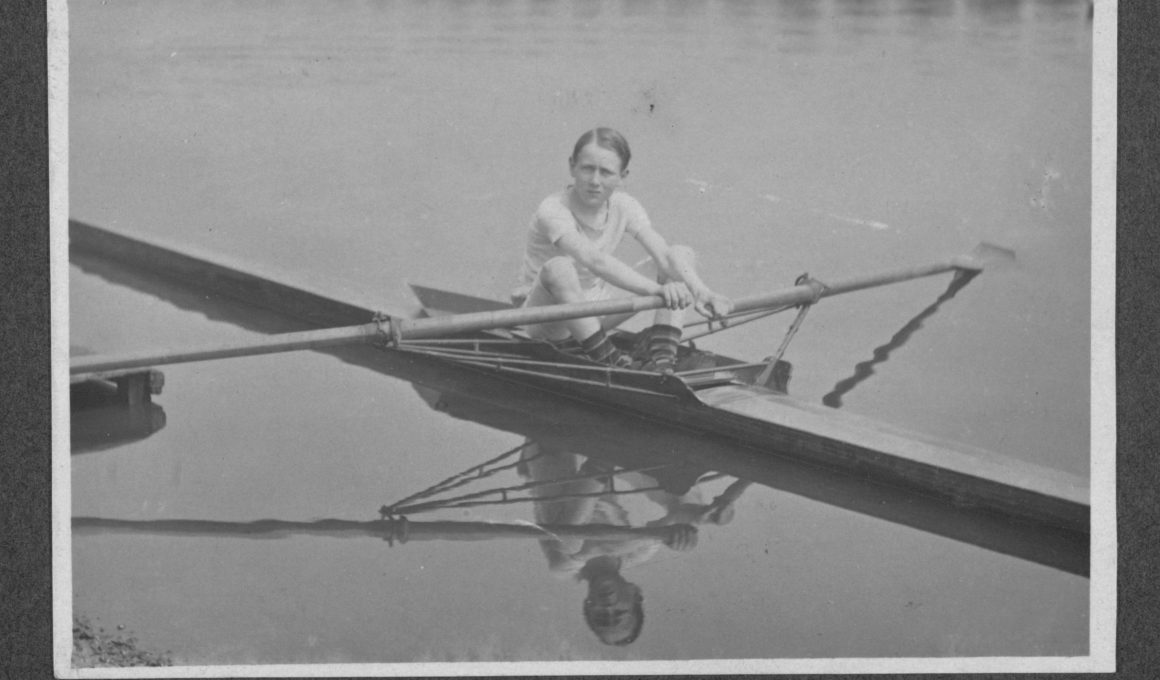 Black and white photograph of a 12-year-old Jack Beresford on the Thames in 1911, with his name written in his own handwriting beneath the image.