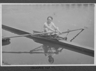Black and white photograph of a 12-year-old Jack Beresford on the Thames in 1911, with his name written in his own handwriting beneath the image.