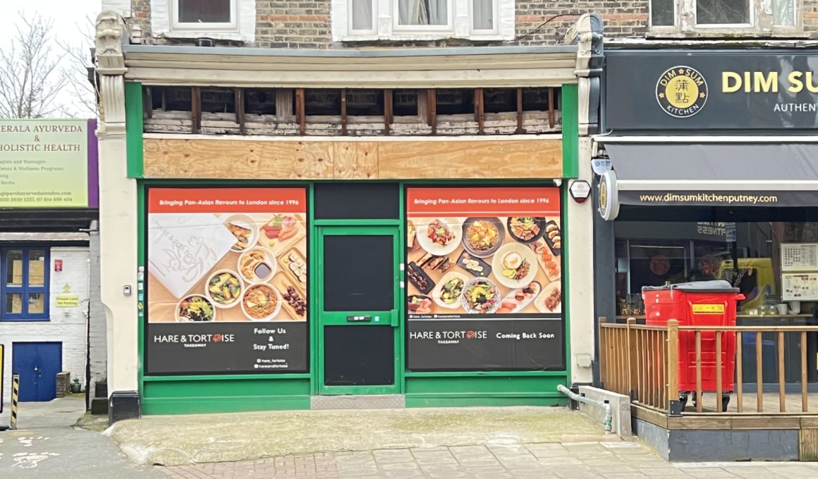 Row of shopfronts on a street: left Kerala Ayurveda sign, middle green-framed storefront with large food posters, right Dim Sum Kitchen signage.