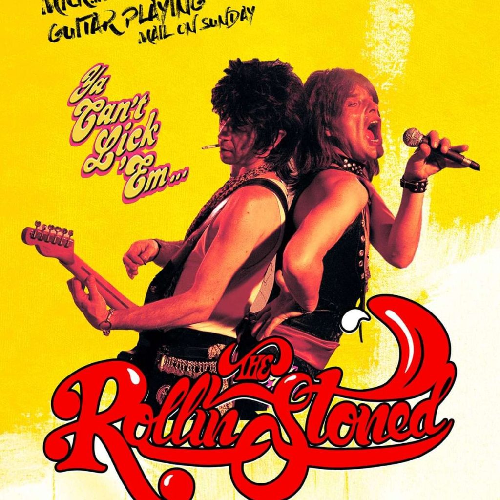 Two rock musicians back-to-back on a bright yellow poster: guitarist left, singer right with a microphone, bold red logo at the bottom.