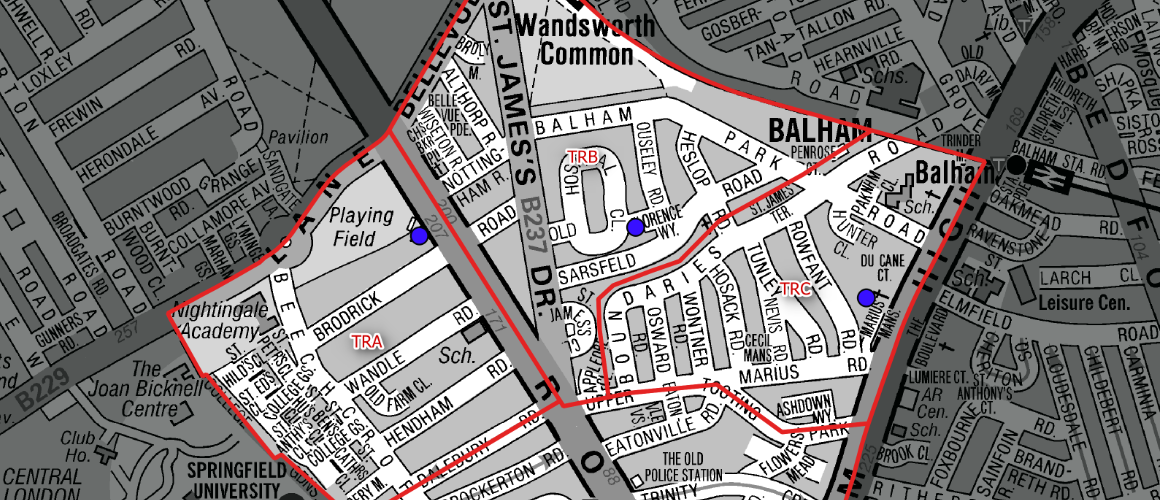 Map with a red boundary outlining a district around Balham and Wandsworth Common; many street names and blue markers indicate key locations.
