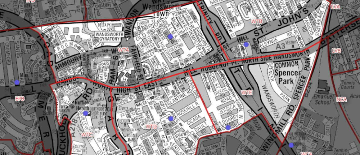 Detailed city map with red district boundaries, grey streets, and blue location markers.