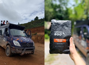 Two-panel photo: left shows a blue off-road van with people on the roof rack driving on a dirt track; right shows a hand holding a Curious Roo Barn Door Blend coffee bag outdoors.