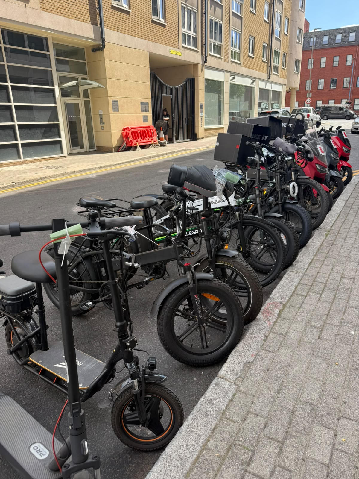 Some of the mopeds, e-bikes and e-scooters seized by Putney officers at the Putney High Street junction. Pic: Metropolitan Police