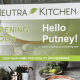 Sign for Neutra Kitchen announcing opening soon in Putney, with a green banner and 'Hello Putney!'