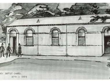 Sketch of Putney Baptist Chapel: a single-story brick building with arched windows, a few people at the entrance, and the inscription 'Putney Baptist Chapel 1876–1884' at the bottom.