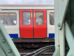 A District Line train crossing the Thames over Putney bridge