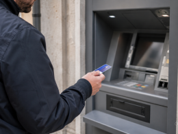 Someone using an ATM machine