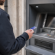 Someone using an ATM machine