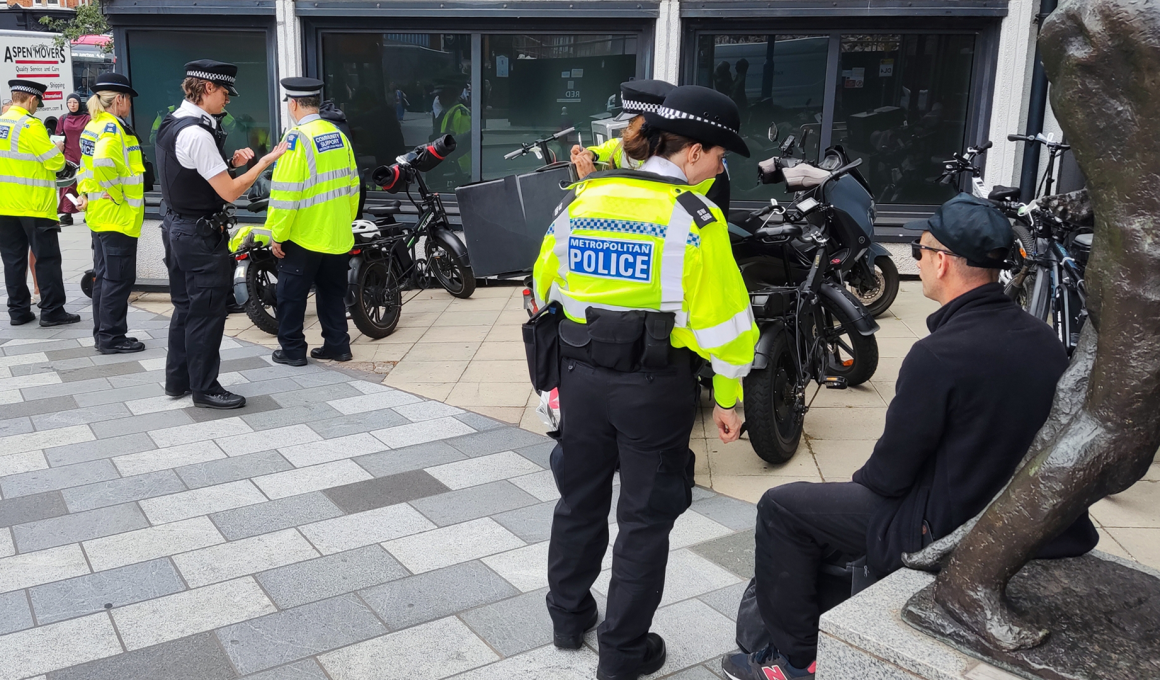 Putney officers speak to a man during the operation. Pic: Michael Madden