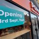 Popeye's opening sign on Putney High Street