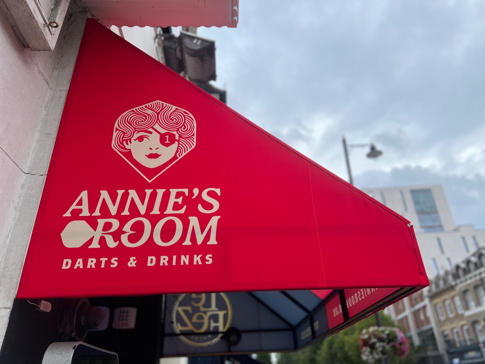 The Annie's Room awning, showing Annie wearing an eyepatch with a 1 on it