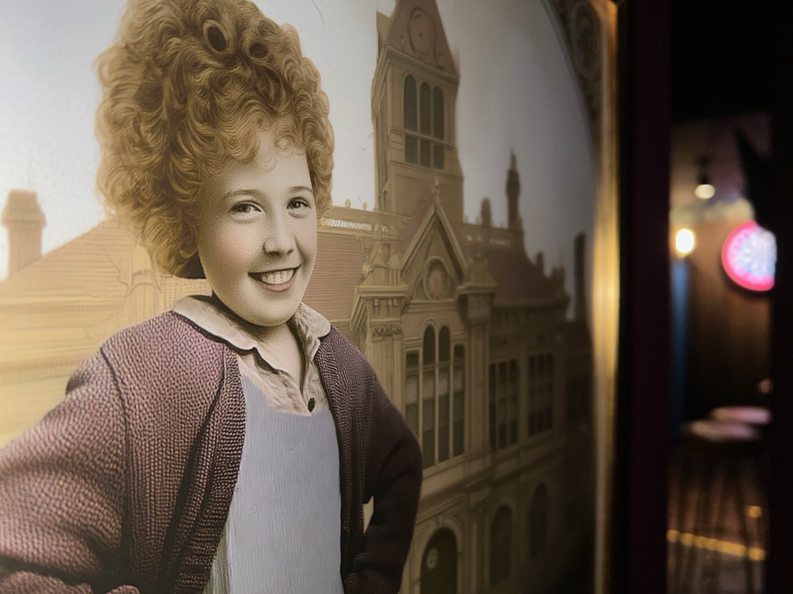 A portrait of Annie on the wall