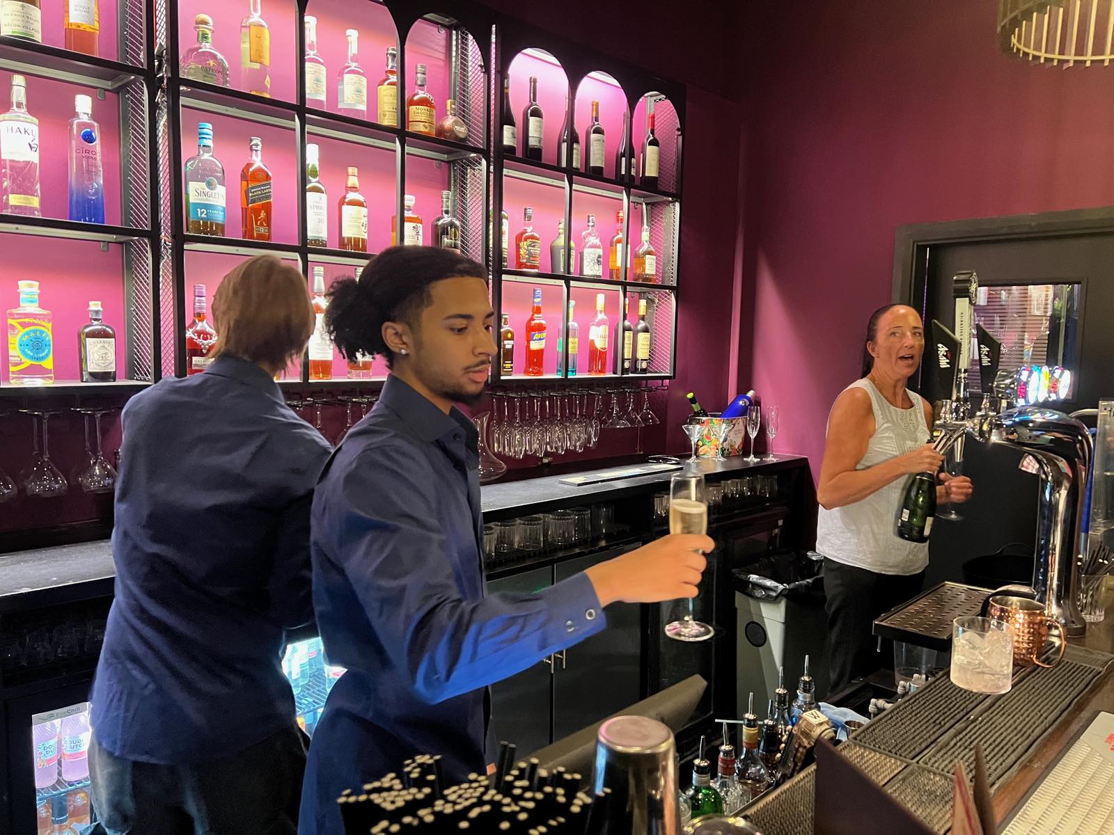 Bar staff serving at the Annie's Room bar