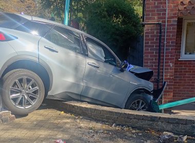 The car wedged against the brick front of the block on Clarence Lane, two days after the crash. Pic: Antony Arthur
