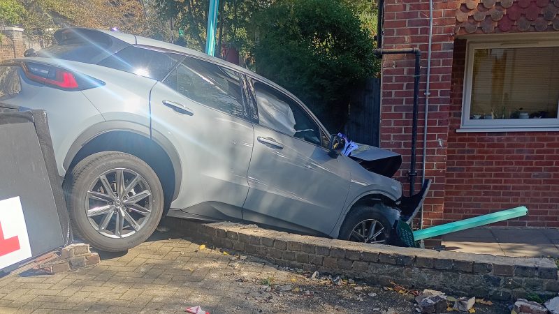 The car wedged against the brick front of the block on Clarence Lane, two days after the crash. Pic: Antony Arthur