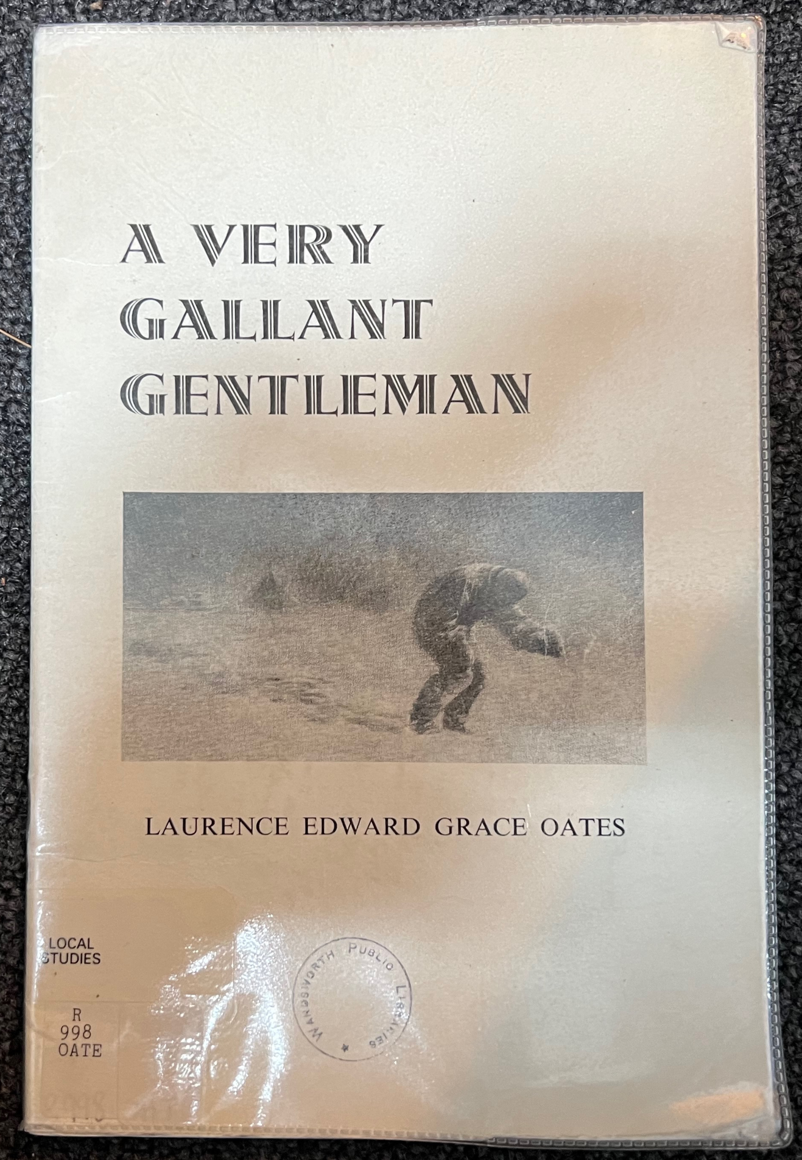 Cover of a library booklet titled A Very Gallant Gentleman, with a photo of a figure walking into a blizzard and a Local Studies label reading R 998 OATE